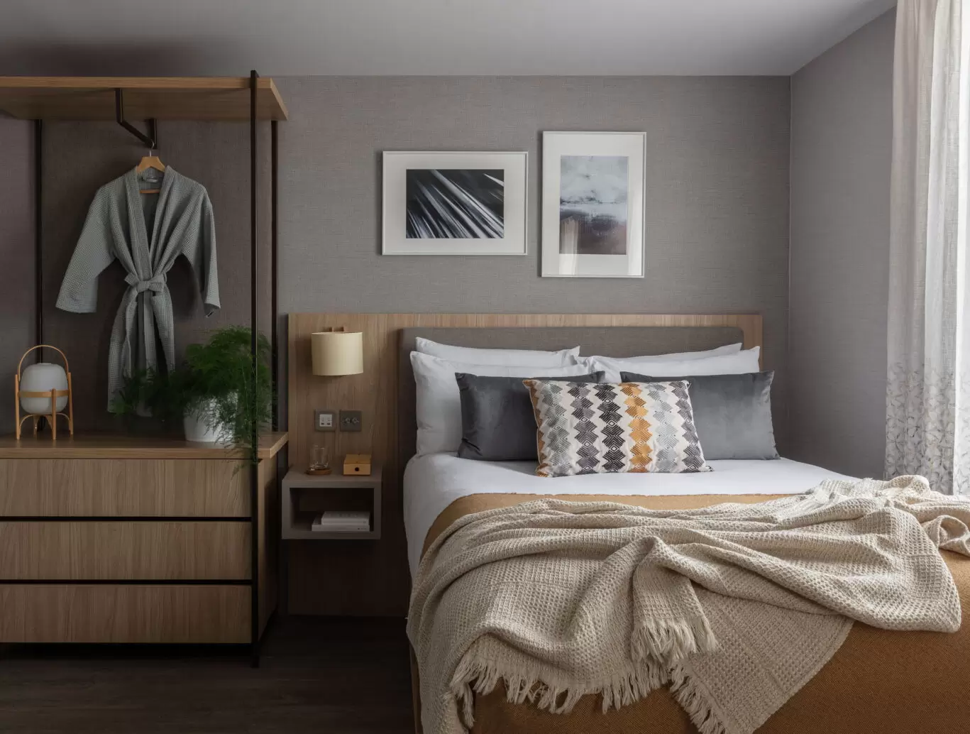 bedroom with bed and bedside storage area