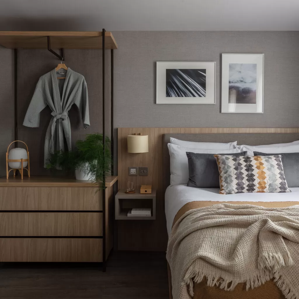 bedroom with bed and bedside storage area